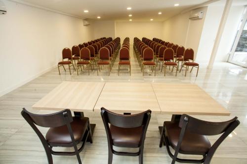 a conference room with chairs and a large table in it at Royal Regency Palace Hotel in Rio de Janeiro
