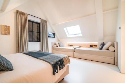 Cama o camas de una habitación en De Kaleihoeve