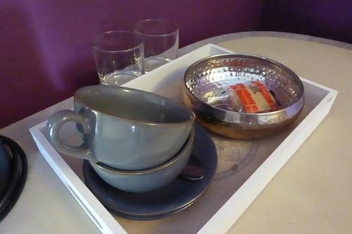 a tray with a cup and a bowl on a table at The Crown Inn, Kemerton in Tewkesbury