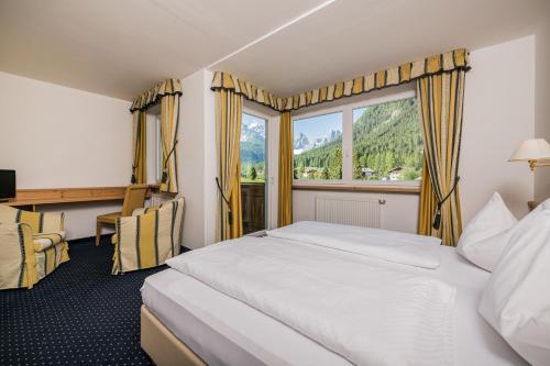 Postel nebo postele na pokoji v ubytování Hotel Waldheim