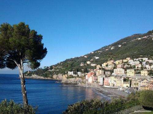 a town on a hill next to the ocean at Oltre Mare in Sori