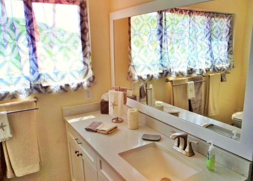 a bathroom with a sink and a mirror at Luxury Sapphire Beach Resort and Marina 1BR VII in East End