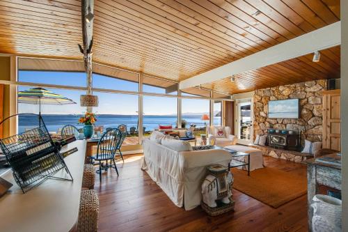 a living room with a view of the ocean at Sunlight Beach Shoreline in Clinton