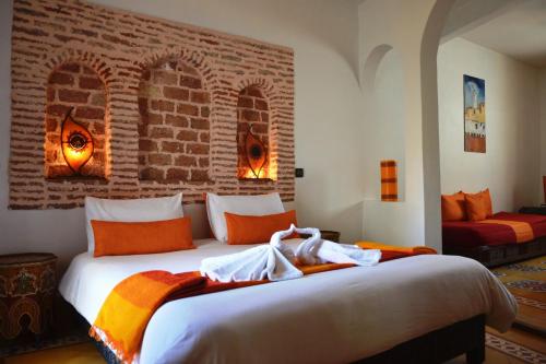 A bed or beds in a room at La Maison Du Vent
