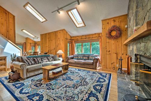 a living room with two couches and a fireplace at Spacious Dover Home with Sauna Less Than 5 Miles to Ski! in Dover