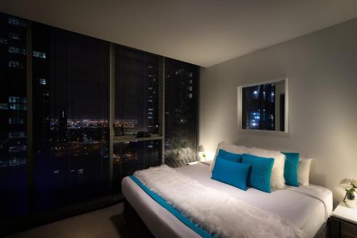 Ένα ή περισσότερα κρεβάτια σε δωμάτιο στο Milano Serviced Apartments