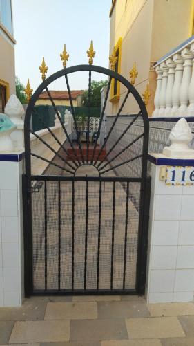 a gate in a building with a building at LA CAMPANA in Orihuela Costa