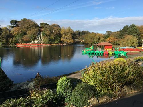 a water park with a ride in the middle of a lake at Stylish apartment with free parking, lift & views in Scarborough