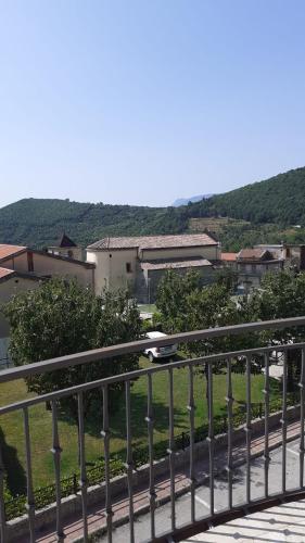 a train traveling down a track on a bridge at Casa Vacanze Mercolino in Bracigliano