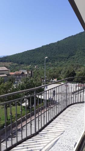a bridge over a road with a mountain in the background at Casa Vacanze Mercolino in Bracigliano