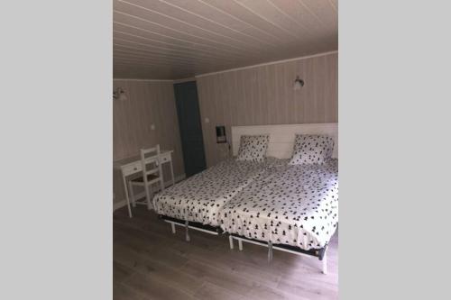 A bed or beds in a room at Appartement ST Roch