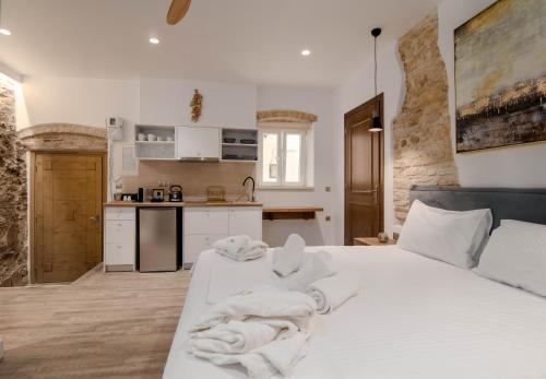 Kuchyňa alebo kuchynka v ubytovaní Curcumelli Luxury Suites - Portoni 1