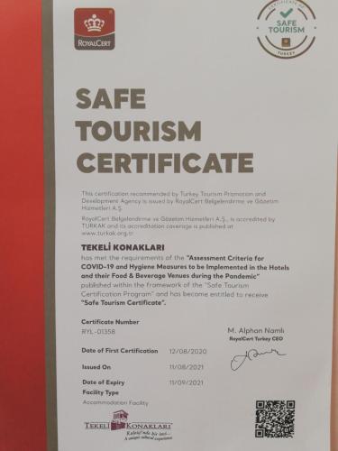 a sign for a safe tourism certificate at a restaurant at Tekeli Konaklari in Antalya