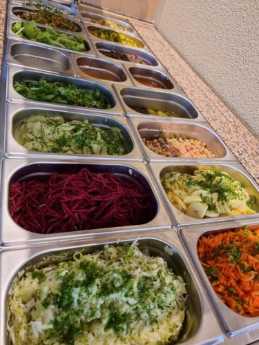 a bunch of trays filled with different types of vegetables at Haiminger Hof in Haiming