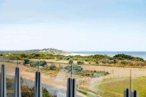 a view of the ocean from a house at Wyndham Resort Torquay in Torquay