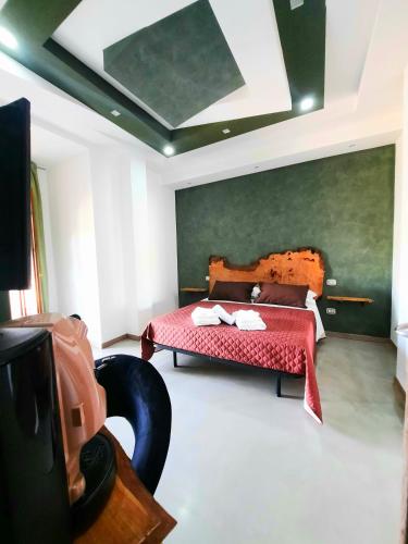 a bedroom with a bed and a tv in it at WiSaRelax in Brusciano