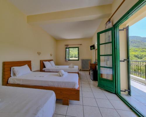 Postel nebo postele na pokoji v ubytování Hotel Spiridoula