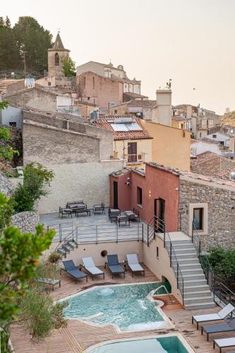 a view of a pool with chairs and stairs at Gratteri Resort in Gratteri
