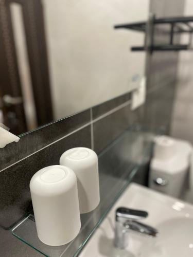 a bathroom counter with a sink and a mirror at Ryokou in Hualien City