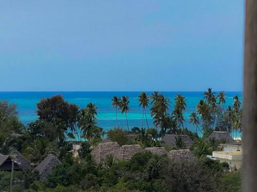a view of the ocean from a resort at Zanzibar Tropical Sunset Boutique Hotel - Adults Only in Kiwengwa
