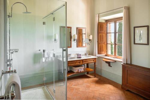 a bathroom with a shower and a sink at Castello Banfi - Il Borgo - Relais et Chateaux in Montalcino