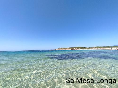 a view of the ocean from the beach at Alabe Hotel Marina di Tresnuraghes in Tresnuraghes
