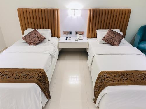 Postel nebo postele na pokoji v ubytování White Orchid