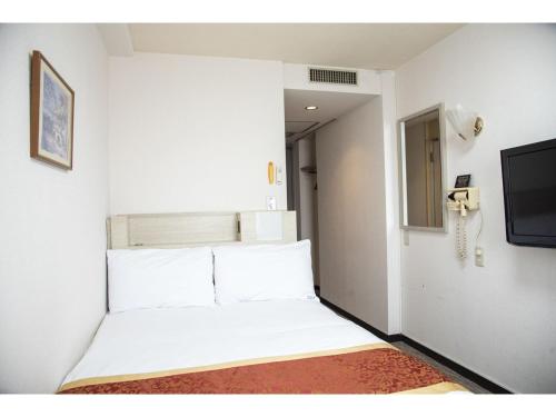 A bed or beds in a room at Osaka Bay Plaza Hotel - Vacation STAY 44083v