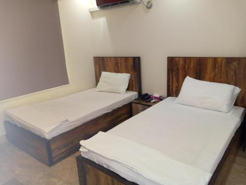 Cama o camas de una habitación en Pearl Cottage Guest House