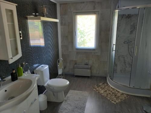 a bathroom with a toilet and a shower and a sink at SRB Sadovo-Resort-Bulgaria in Sadovo