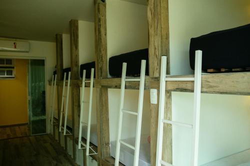 a row of bunk beds in a room at Hostel House Santinho in Florianópolis