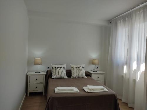 Postel nebo postele na pokoji v ubytování b Apartamentos Diego