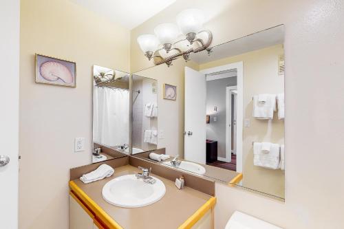 a bathroom with a sink and a mirror at Simba Run in Vail