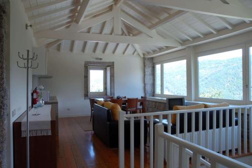 a living room with a couch and a table at Aldeia Turistica de Louredo in Vieira do Minho