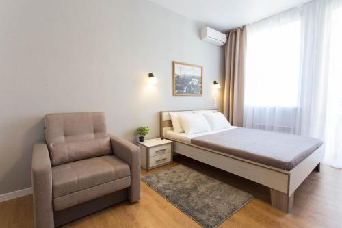 Ένα ή περισσότερα κρεβάτια σε δωμάτιο στο Modern studio beside metro Yaroslava Mudroho, Universytet - Chernyshevska str 95-7