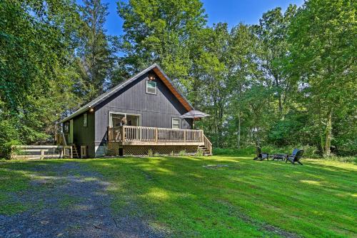 a barn with a deck and a bench in a yard at Deck and Gas Grill Modern East Stroudsburg Home! in East Stroudsburg