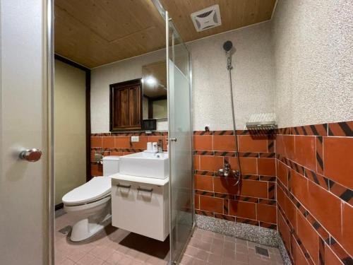 Un baño de 金門古寧歇心苑官宅古厝民宿 Guning Xiexinyuan Historical Inn