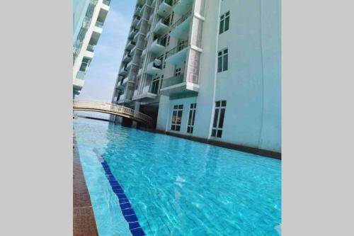 a swimming pool in front of a building at KSL City Mall 6-8pax（K26）Netflix｜Smart TV 55inch in Johor Bahru