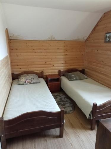 Postel nebo postele na pokoji v ubytování Карпатська казка