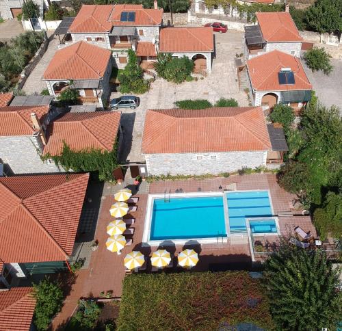an aerial view of a house with a swimming pool at Stephanou Inn in Agios Nikolaos