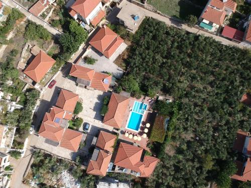 an overhead view of a house with a pool at Stephanou Inn in Agios Nikolaos
