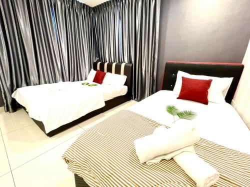 two beds in a room with black and white curtains at KSL City Mall 6-8pax（K26）Netflix｜Smart TV 55inch in Johor Bahru
