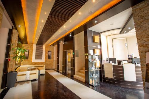 a lobby of a store with a couch and a table at Zen apartman in Kopaonik