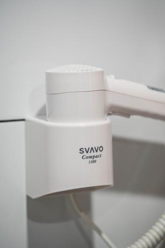 a white sewing machine with a label on it at Lahili Boutique Hotel in Mestia