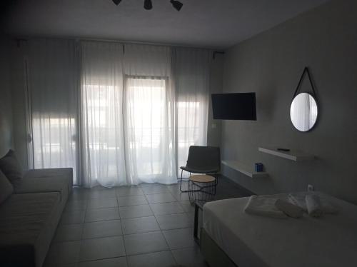 Ein Bett oder Betten in einem Zimmer der Unterkunft Iasonas View Studio