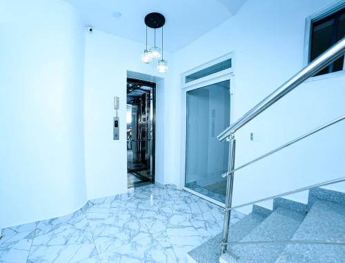 a hallway of a house with stairs and blue lighting at Self-checking-Fast internet-Alexa-Smart-Tv-AC-Hot Water in Ensanche Ozama