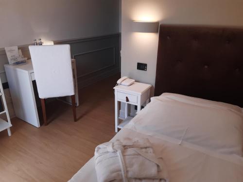 Ein Bett oder Betten in einem Zimmer der Unterkunft Hotel Antico Mulino