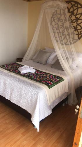 Cama o camas de una habitación en TARAHARA salud y bienestar