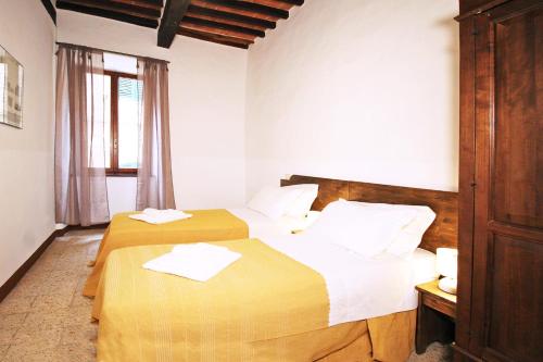 Katil atau katil-katil dalam bilik di Girolamo Apartment - Super Central, Private Parking & Outdoor Area