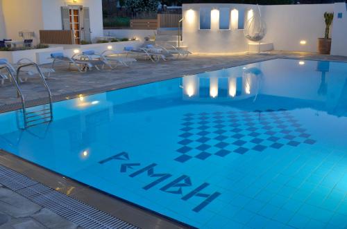 a swimming pool with a checkered floor in a hotel at Remvi in Galissas